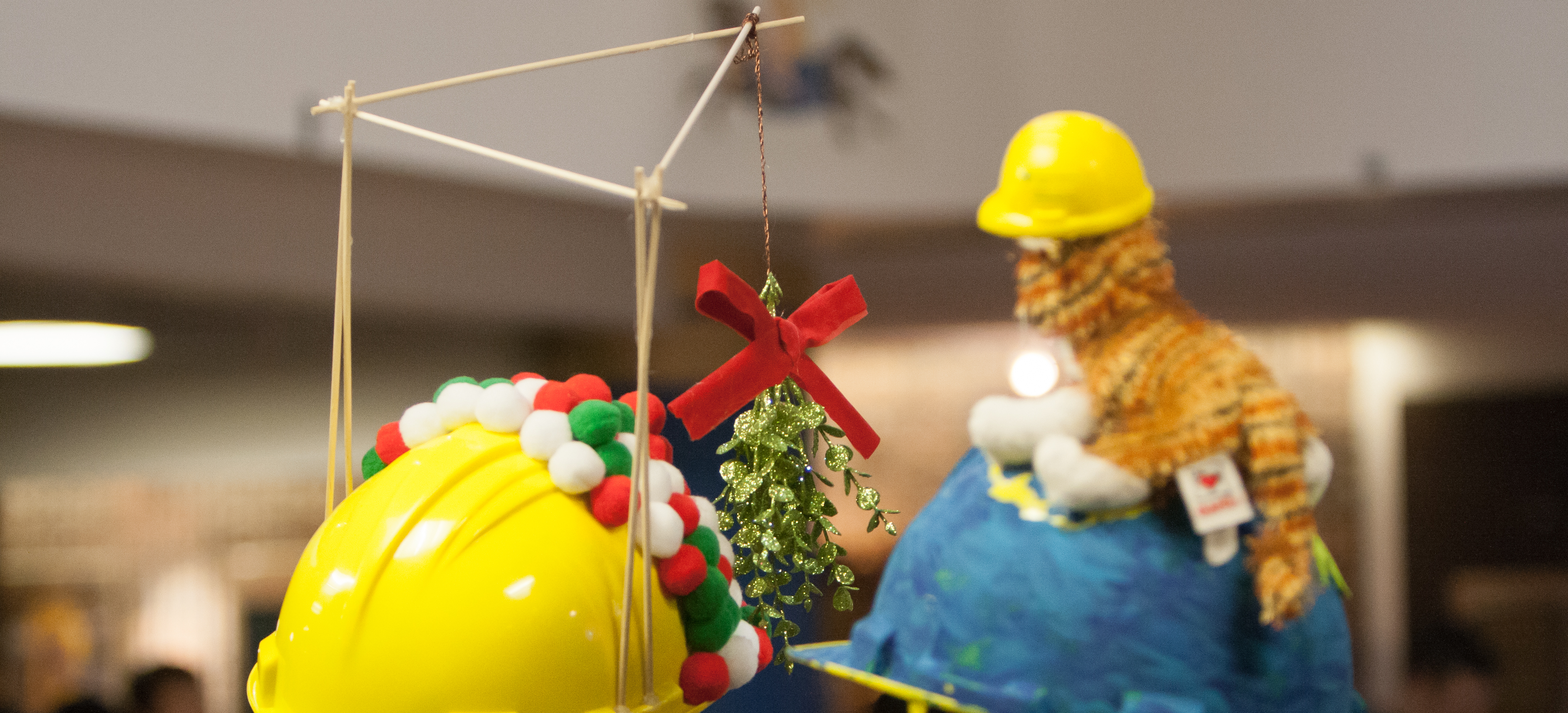 Contestants show off their decorated hardhats
