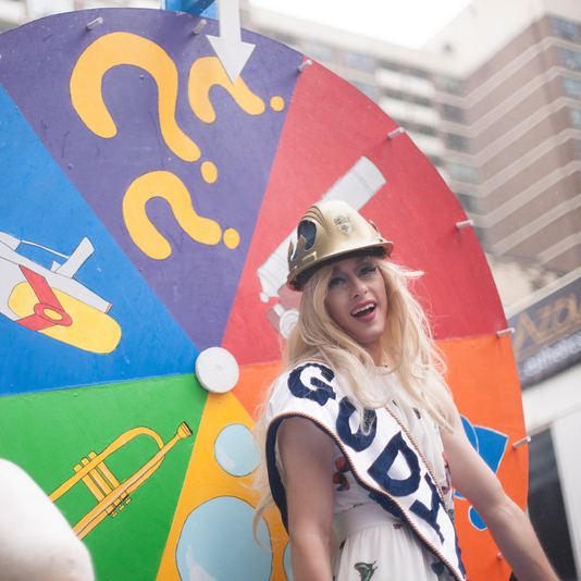 Ron Supron hosts Skule's Wheel of Fortune float during Pride Parade 1T5