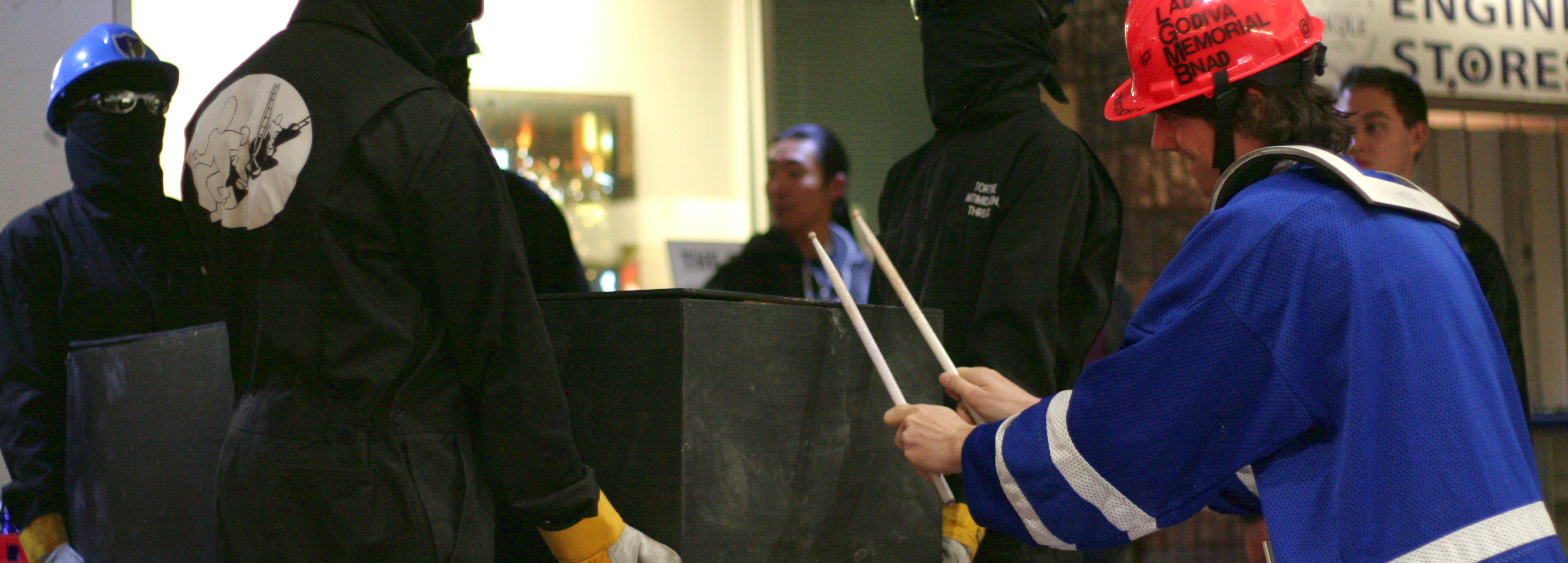 Evan Boyce drums on the coffin held by BFC Ministers.